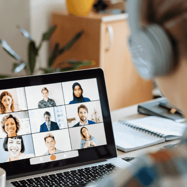Professional participating in a virtual meeting on a laptop, supporting remote collaboration and improving talent acquisition through online connection.