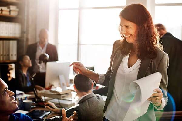 Laughing-woman-leader-in-office-OPTI