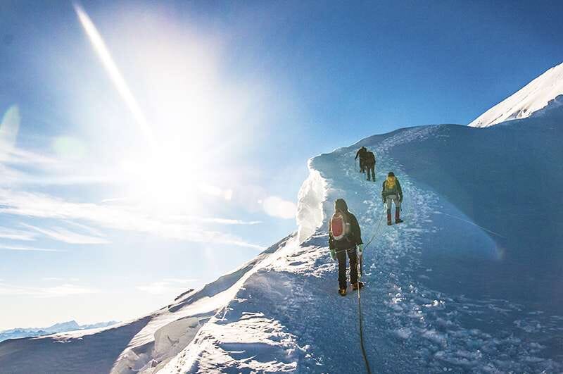 Team-climbing-mountain-working-upwards-smaller