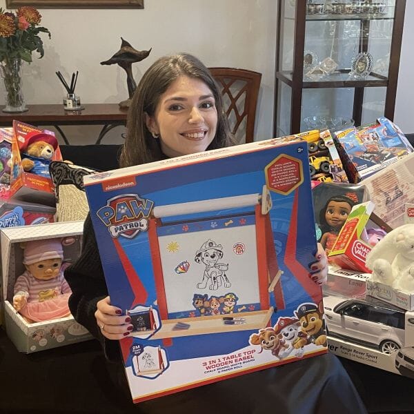 Ellie-Couchman-with-toys-for-the-salvation-army
